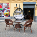 Black Egg Chair + 2 Brown Rattan Tub Chairs + Round Glass-Top Coffee Table